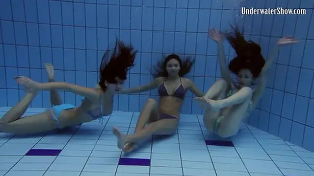 Playful strippers enjoy each other in the pool